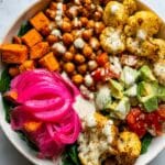 Roasted Cauliflower, Sweet Potato, and Chickpea Bowl with Tzatziki and Tahini Dressing Recipe