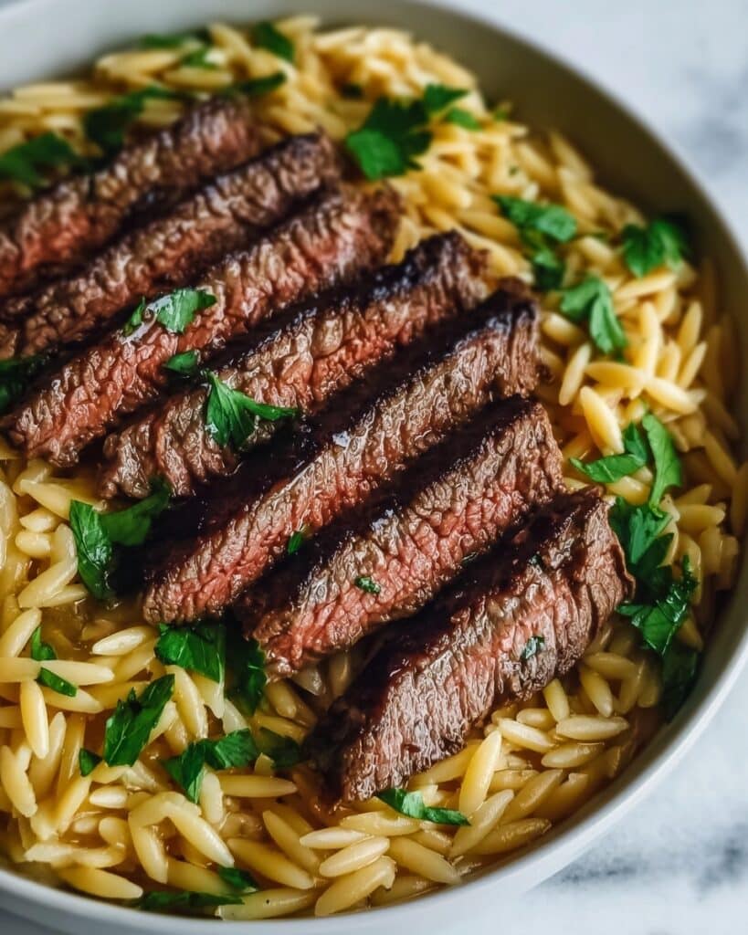Flank Steak with Creamy Sun-Dried Tomato Orzo Recipe