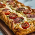 Homemade Stromboli with Pepperoni, Ham, and Mozzarella Recipe