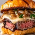 Grilled Ribeye Steak Sandwich with Caramelized Onions, Mushrooms, and Roasted Red Pepper Aioli Recipe