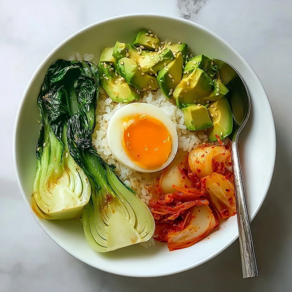 Kimchi Rice Bowl with Jammy Eggs and Creamy Avocado Sauce Recipe - Recipe Image