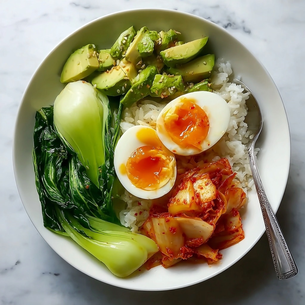 Kimchi Rice Bowl with Jammy Eggs and Creamy Avocado Sauce Recipe - Recipe Image