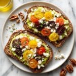 Avocado Toast with Feta, Cherry Tomatoes, Cranberries, and Walnuts Recipe
