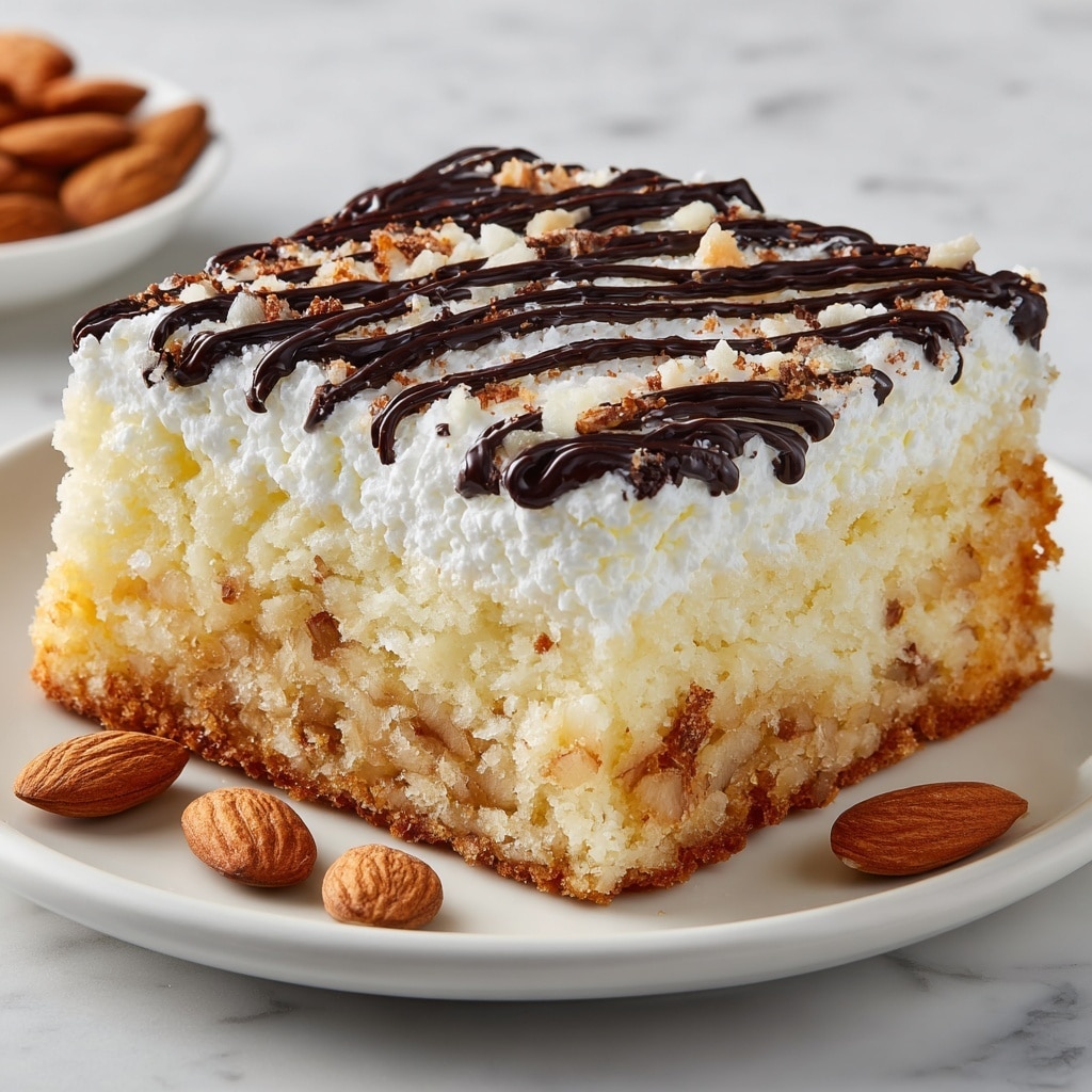 Almond Joy Poke Cake Recipe - Recipe Image