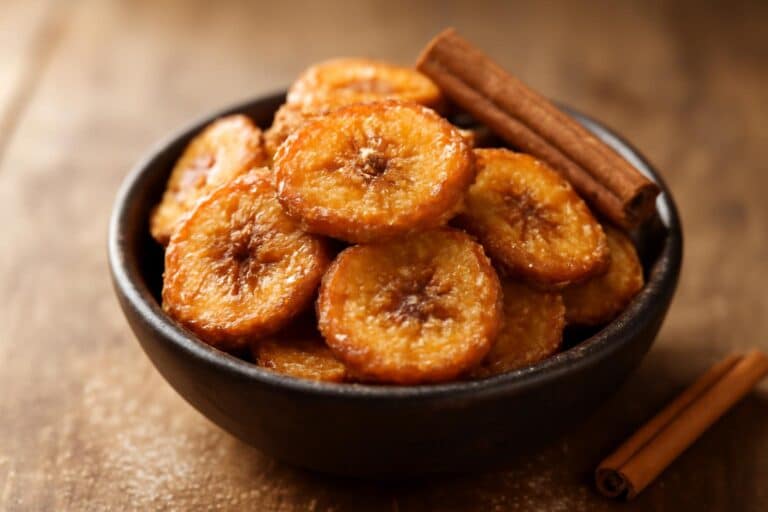 Crispy cinnamon sugar banana chips in a bowl, golden and sweet air fryer snack